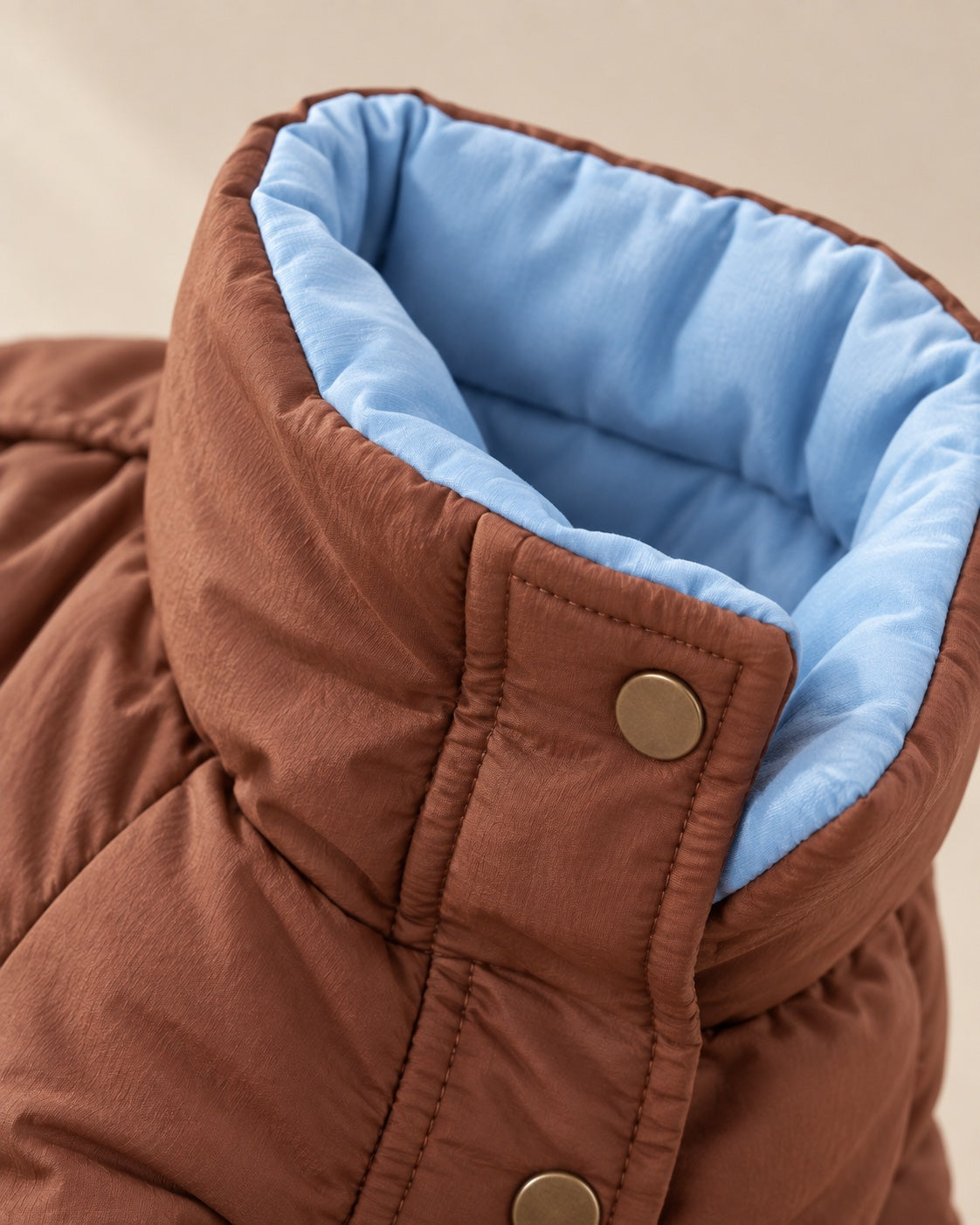 Dönence Reversible Puffer Dog Suit — fabric and fastening detail